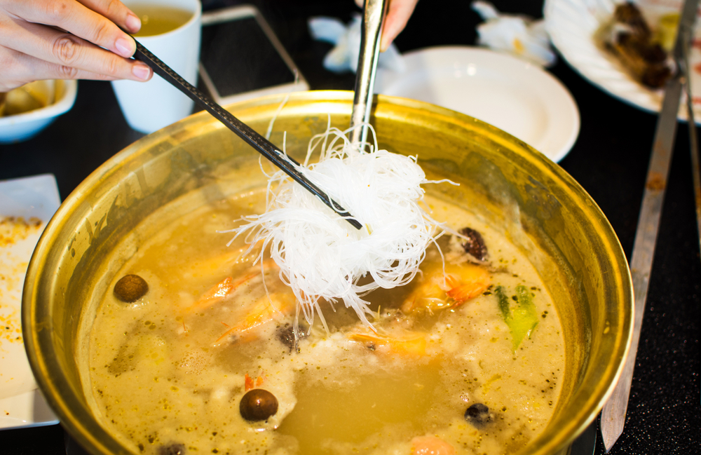 chopsticks-adding-glass-noodles-into-hotpot